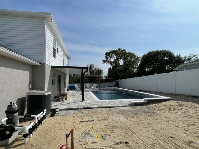 Pergola over pool during construction