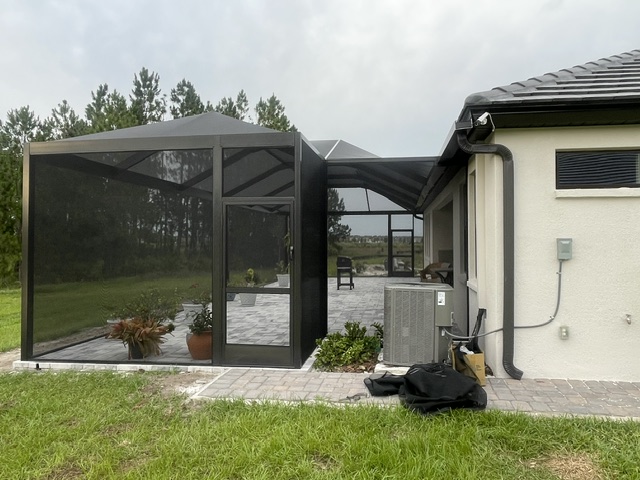 Screen enclosure with entry door