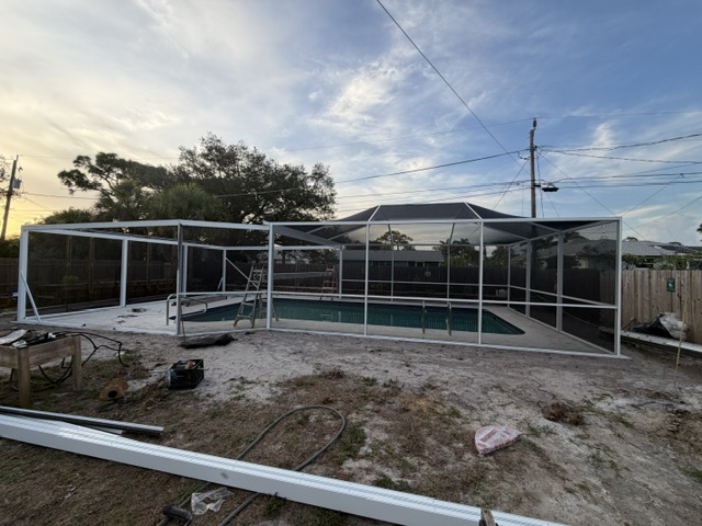 Pool enclosure frame at sunset
